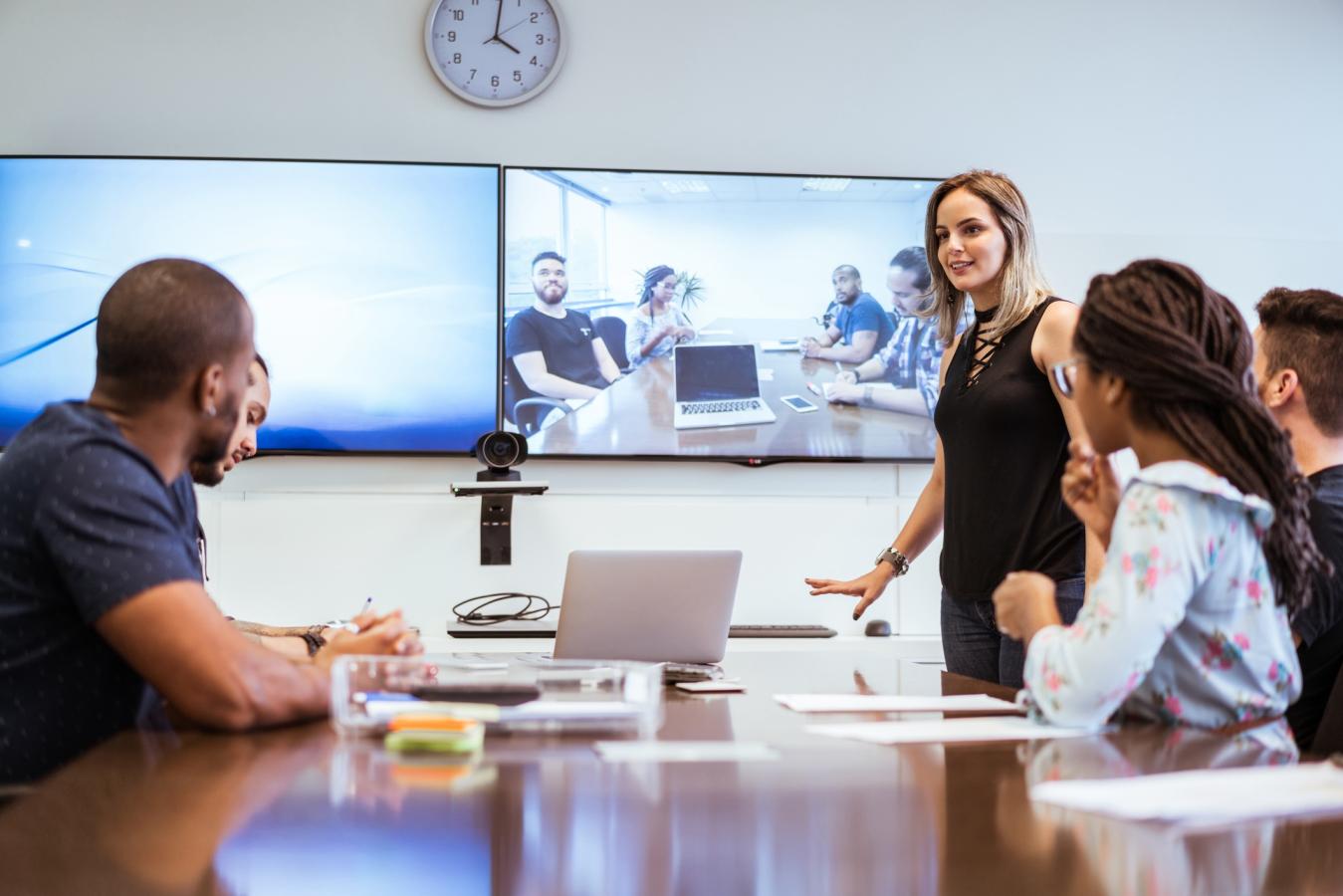 Business teams collaborating via remote via conference